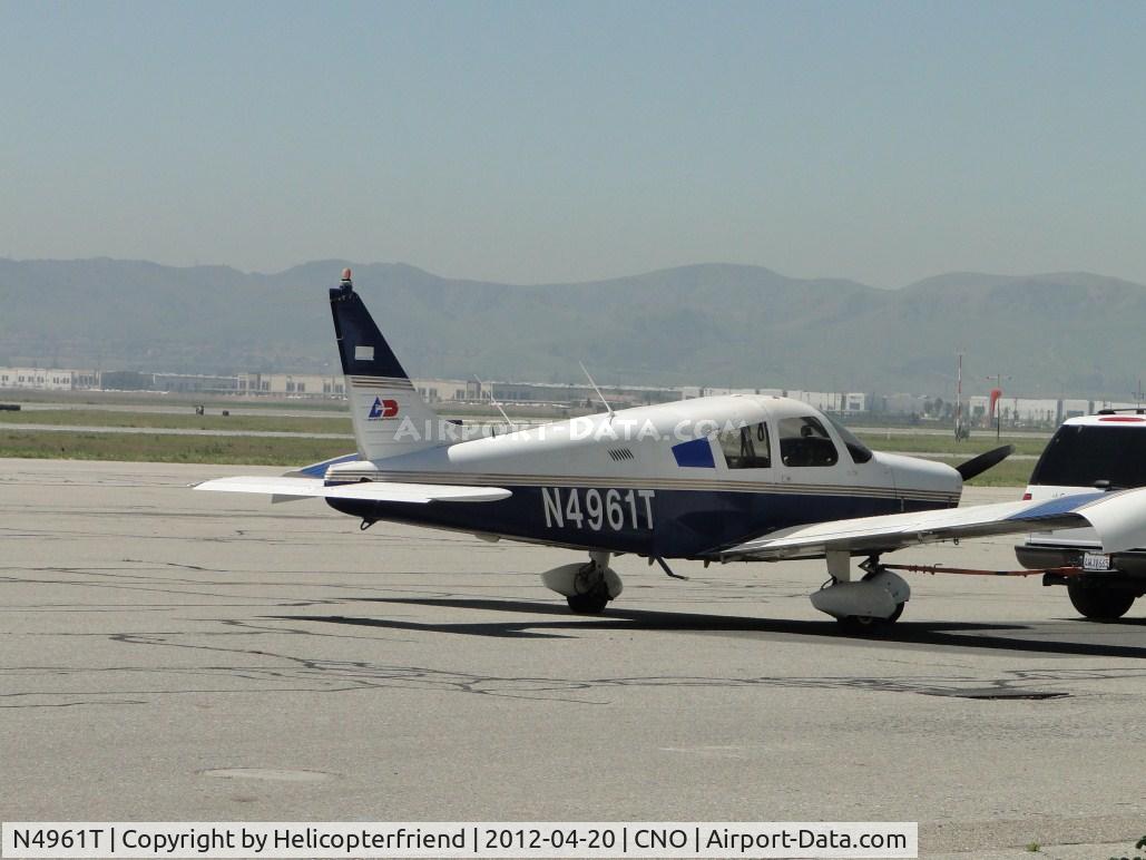 N4961T, 1972 Piper PA-28-140 Cruiser C/N 28-7225289, Being towed westbound south of the tower