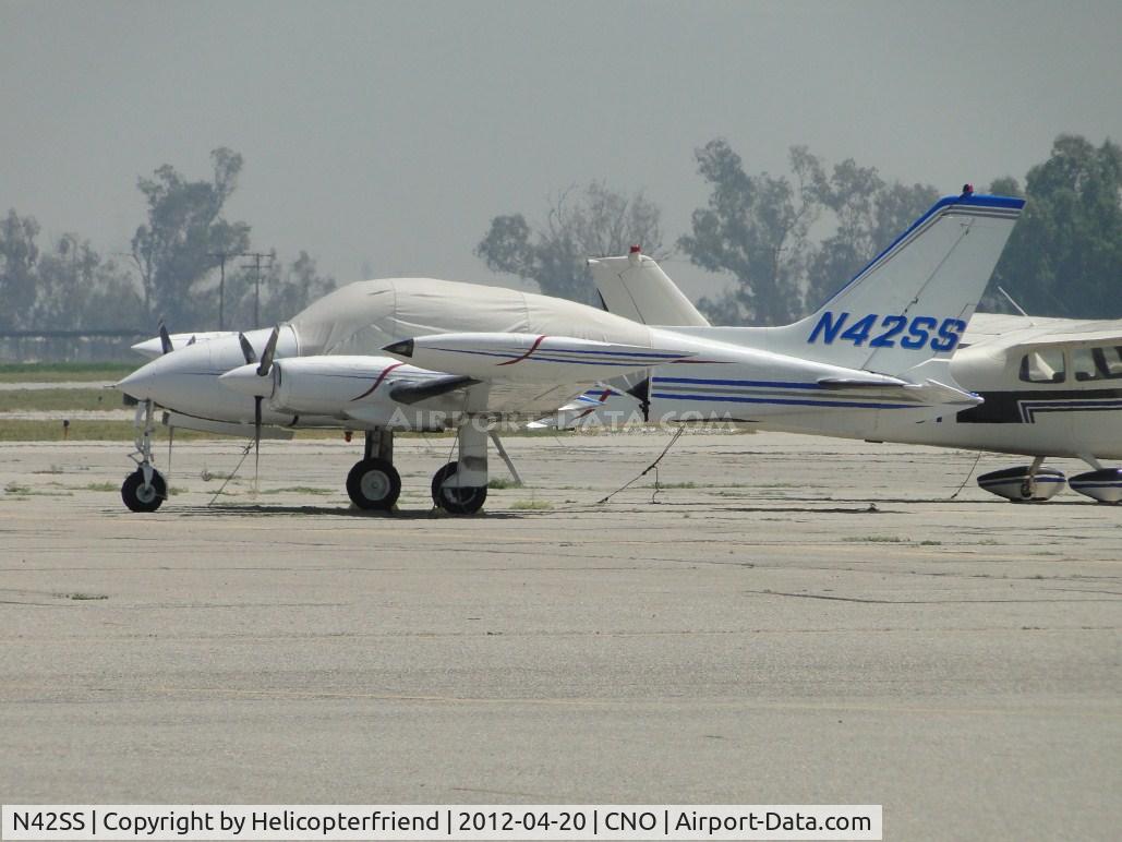 N42SS, 1972 Cessna 310Q C/N 310Q0682, Covered up, chained down and parked east of the tower