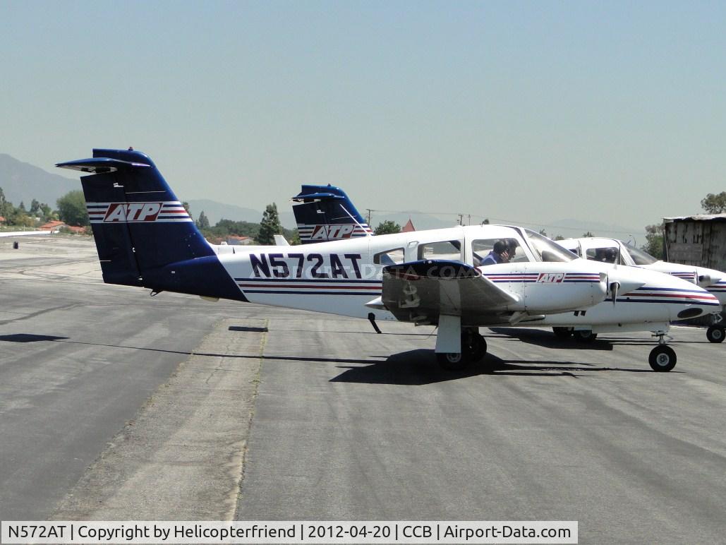 N572AT, 2005 Piper PA-44-180 Seminole C/N 4496194, Parked facing the hangers in transient parking, Instructor giving information to student