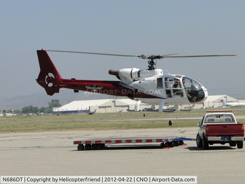 N686DT, 1974 Aérospatiale SA-341G Gazelle C/N 1200, Lift off from towing dolly and headed westbound