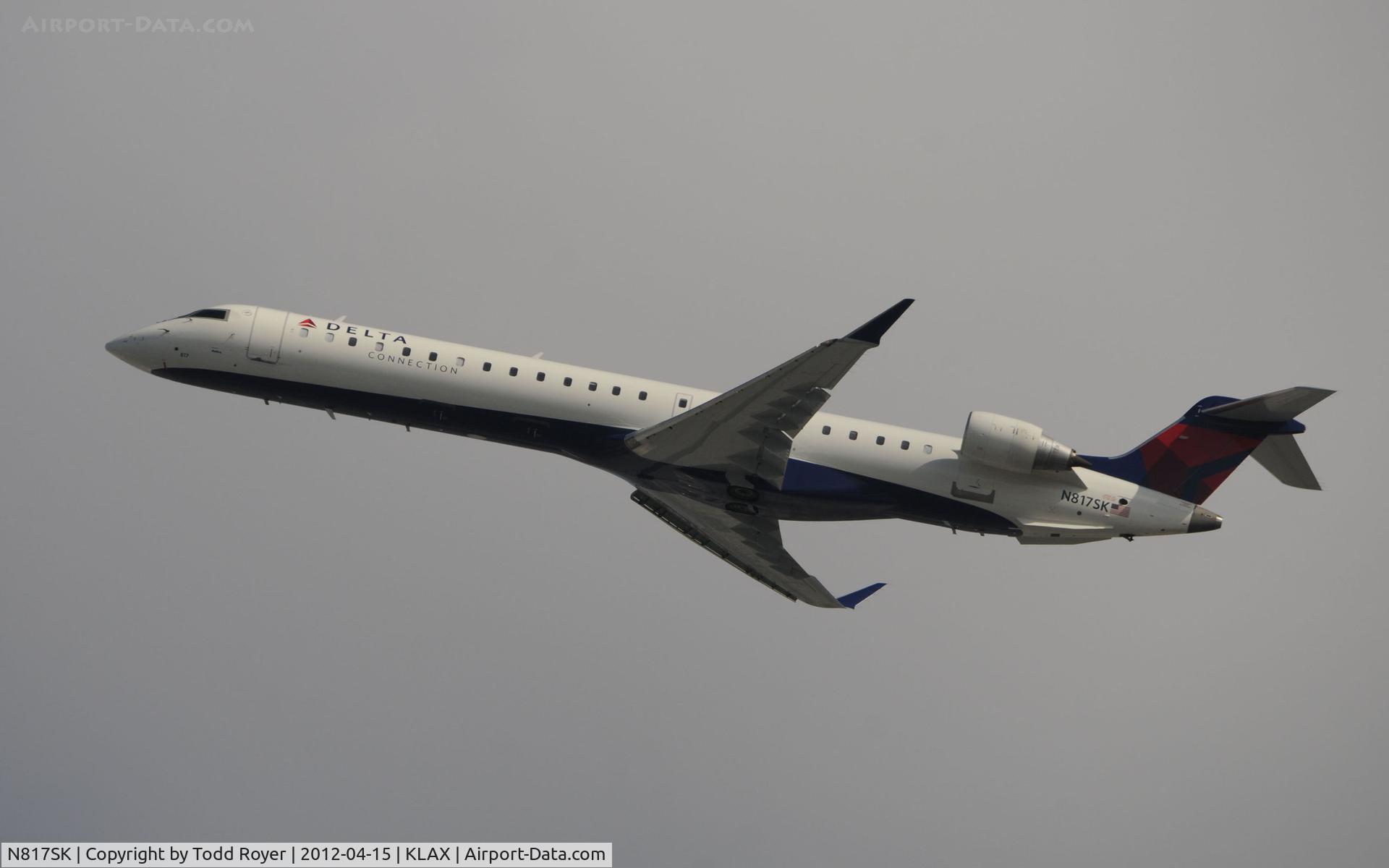 N817SK, 2006 Bombardier CRJ-900ER (CL-600-2D24) C/N 15107, Departing LAX on 25R