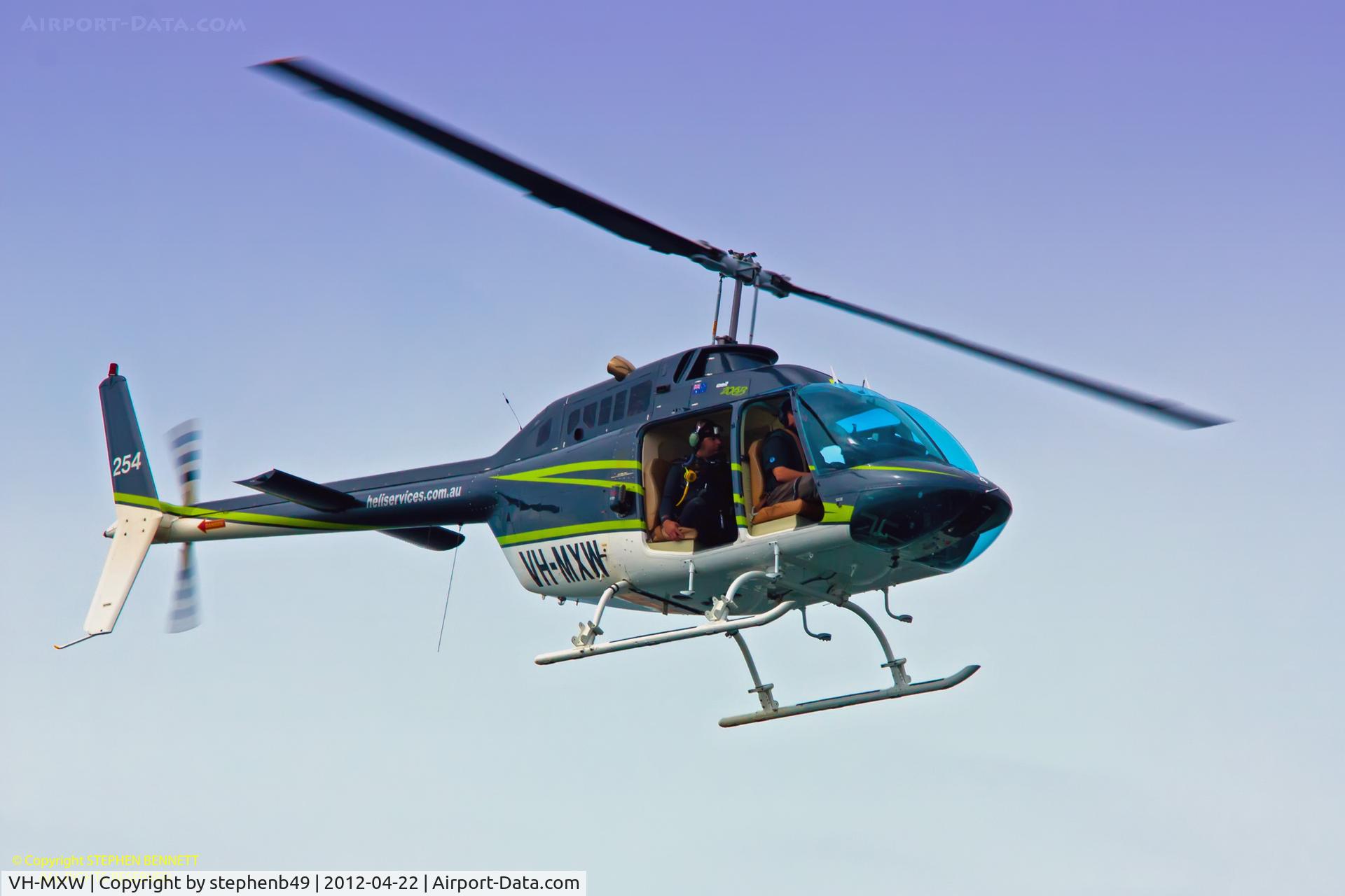 VH-MXW, 1974 Bell 206B JetRanger II C/N 1198, Hovering low in fading light