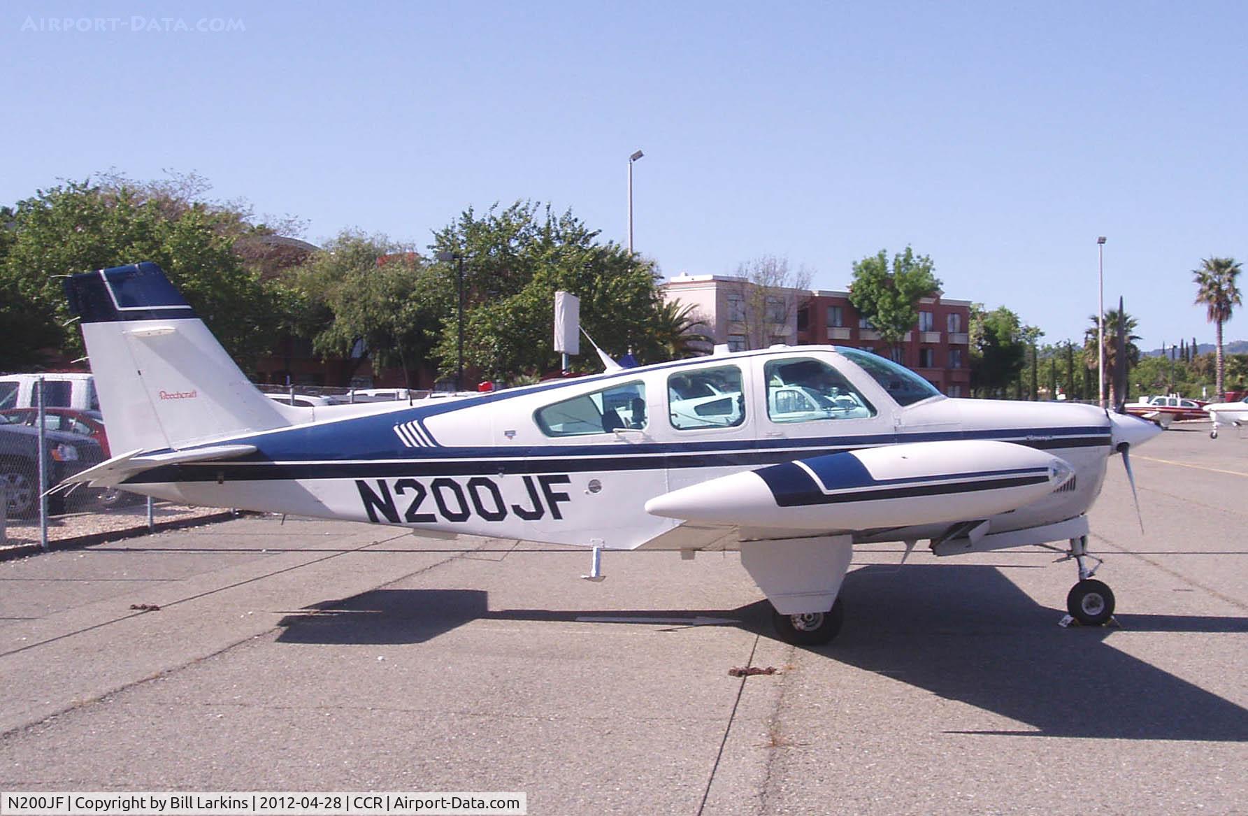 N200JF, 1990 Beech F33A Bonanza C/N CE-1516, In for the 2012 Beech Pilot Proficiency Program. The Crowne Plaza Hotel right on the airport can be seen in the background.