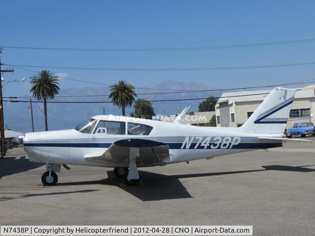 N7438P, 1961 Piper PA-24-250 Comanche C/N 24-2627, Parked by a hanger