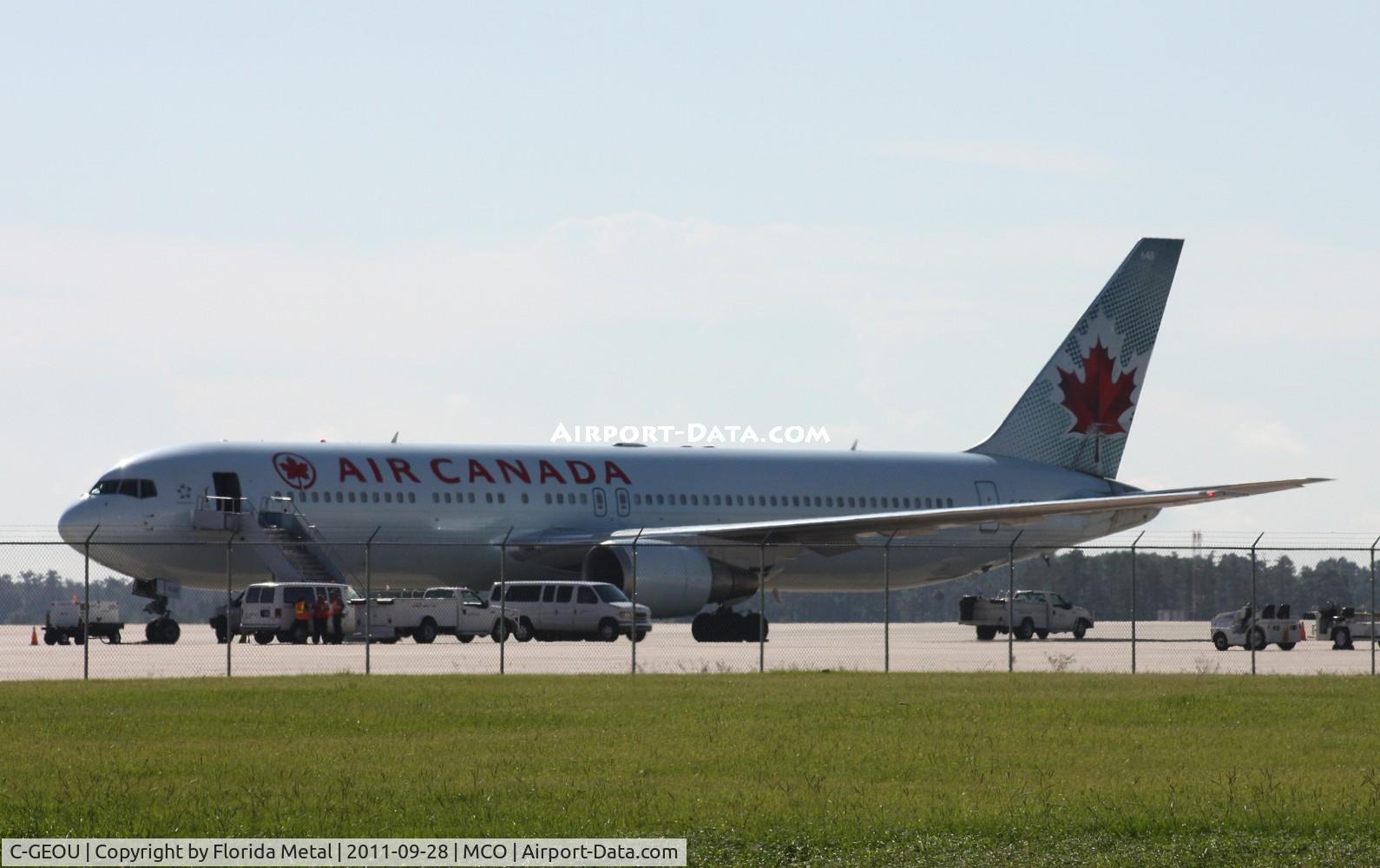 C-GEOU, 1999 Boeing 767-375 C/N 30108, Air Canada 767 backlit on ramp