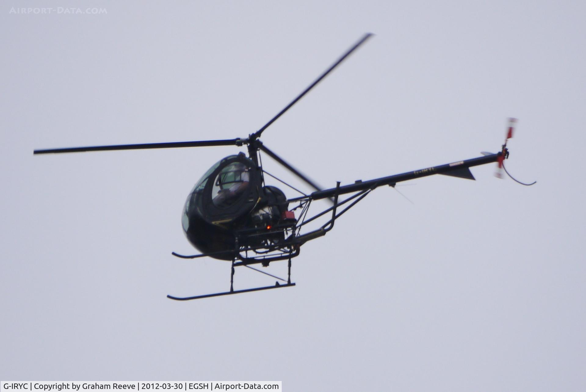 G-IRYC, 2004 Schweizer 269C-1 C/N 0194, Overhead on a dull afternoon.
