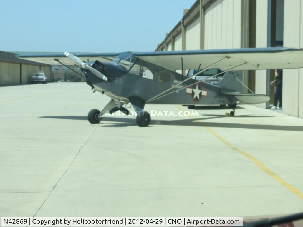 N42869, 1945 Piper J3C-65 Cub Cub C/N 15196, Parked by the hanger