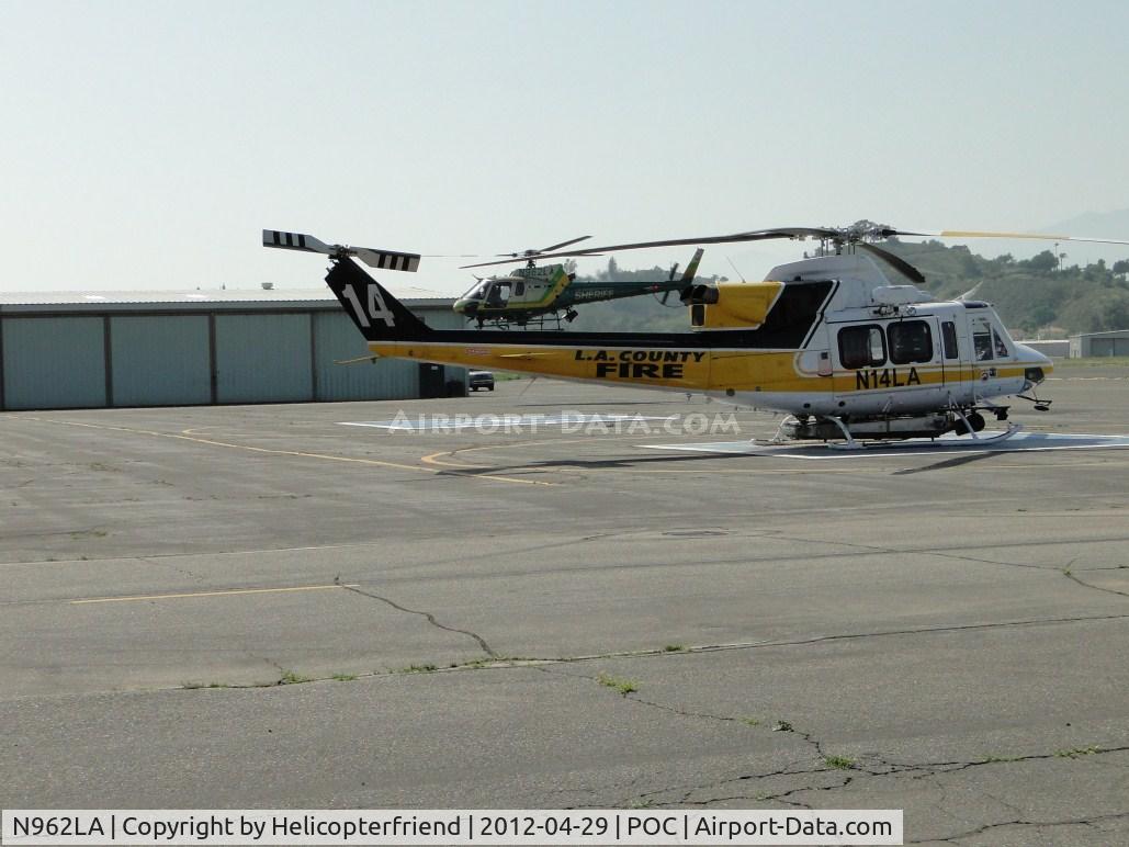 N962LA, Eurocopter AS-350B-2 Ecureuil Ecureuil C/N 7009, Air taxiing southbound past LACO Fire Copter 14, N14LA, enroute to be put in the hanger