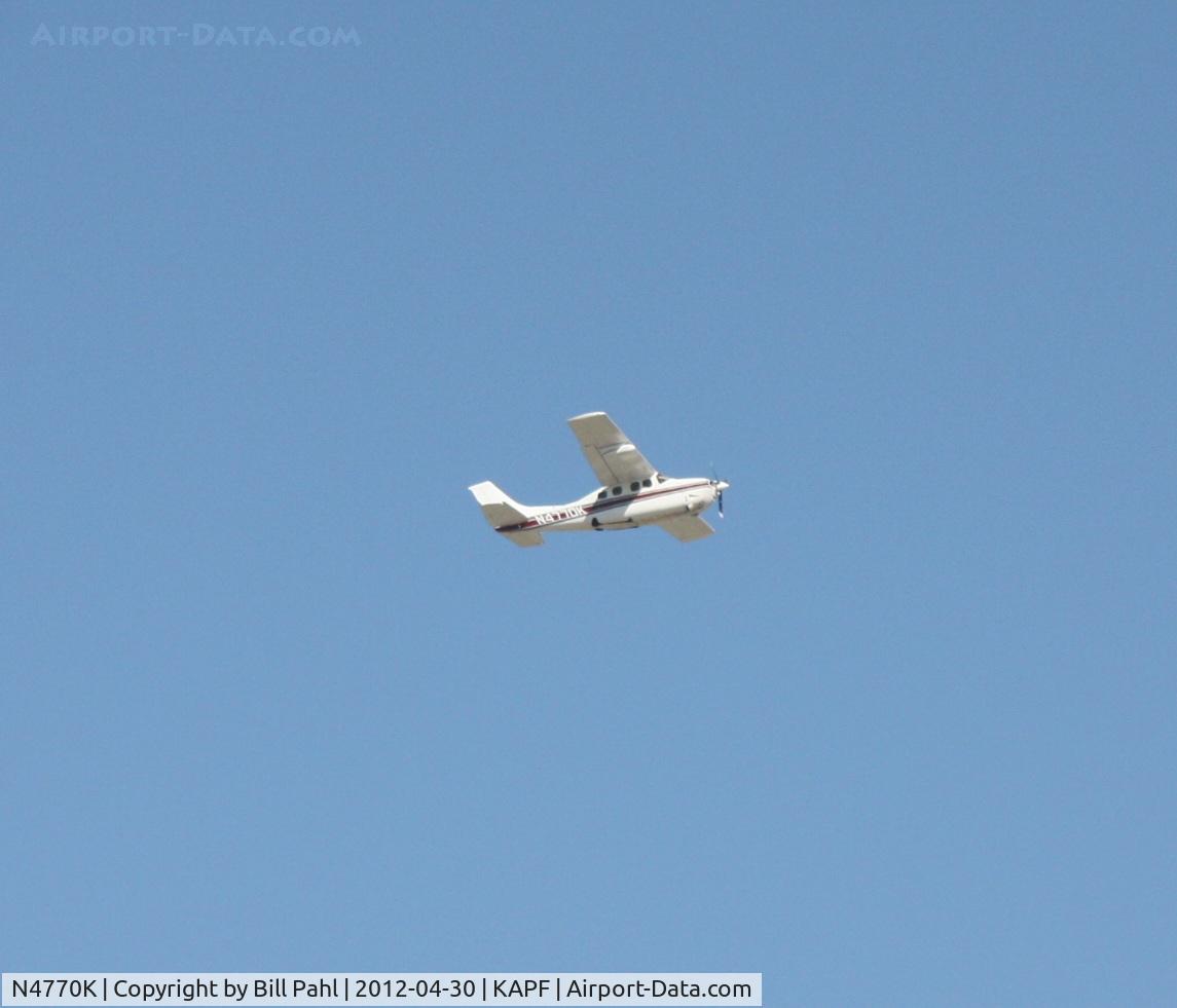 N4770K, 1979 Cessna P210N Pressurised Centurion C/N P21000301, Shortly after takeoff from Naples Municipal