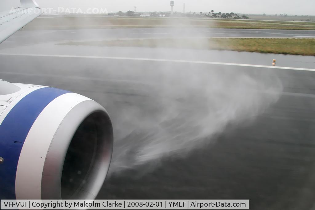 VH-VUI, 2006 Boeing 737-8FE C/N 34441, A wet welcome to Launceston, Tasmania on board Boeing 737-8FE, February 2008