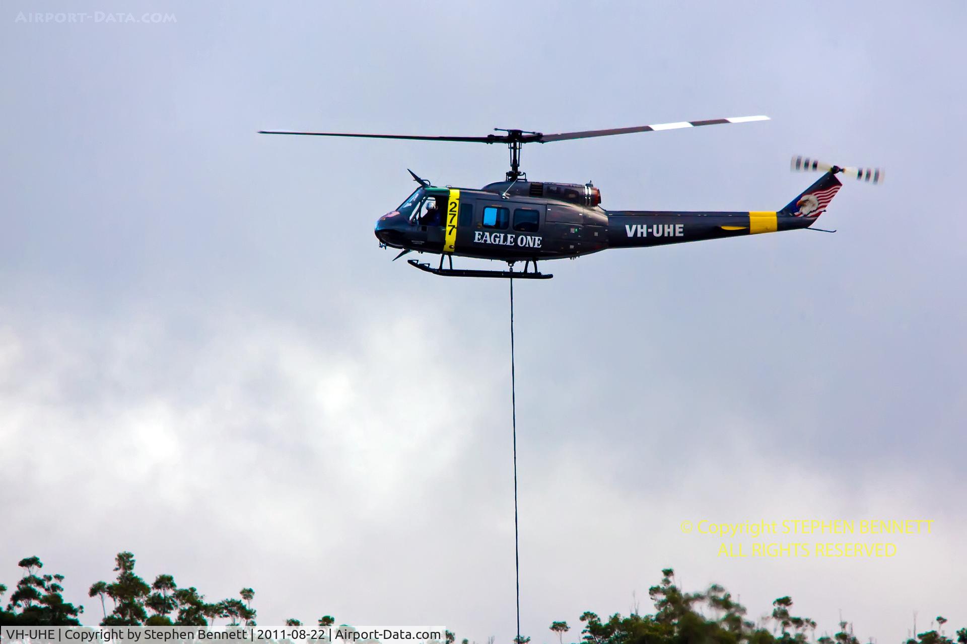 VH-UHE, 1966 Bell UH-1H Iroquois C/N 5995, Making early morning deliveries of landscaping supplies, to Tuggerah Shopping Centre  (Central Coast NSW,Aust)