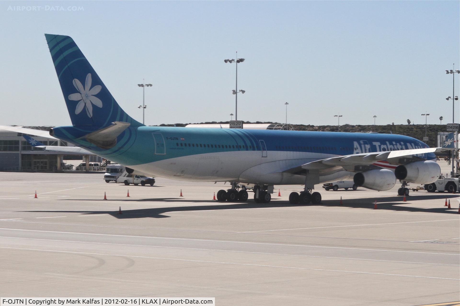 F-OJTN, 2001 Airbus A340-313 C/N 395, Air Tahiti Nui Airbus A340-313 at LAX West/Remote gate 214.