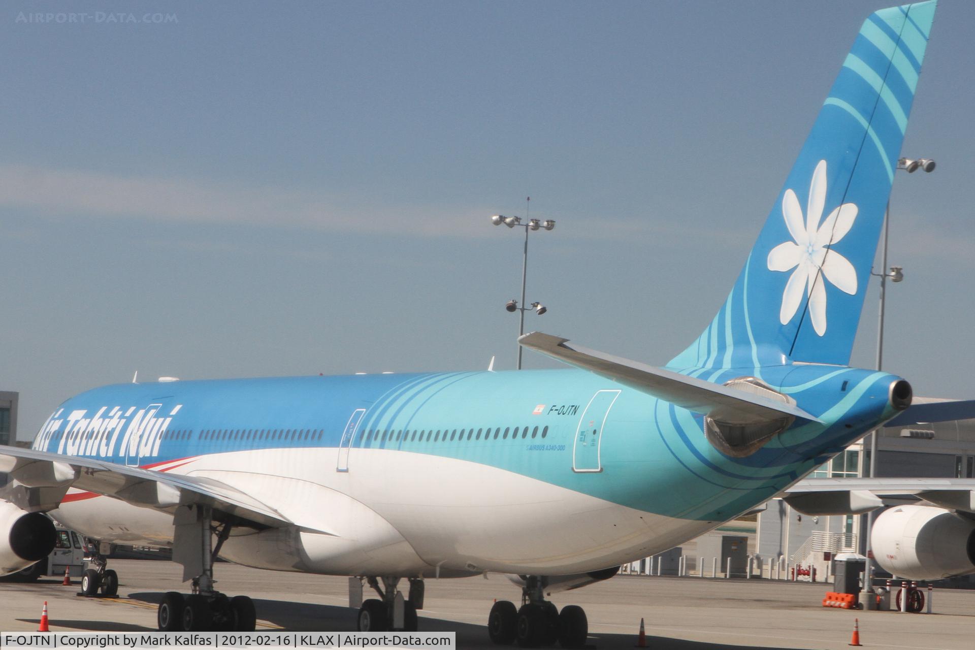 F-OJTN, 2001 Airbus A340-313 C/N 395, Air Tahiti Nui Airbus A340-313 at LAX West/Remote gate 214.