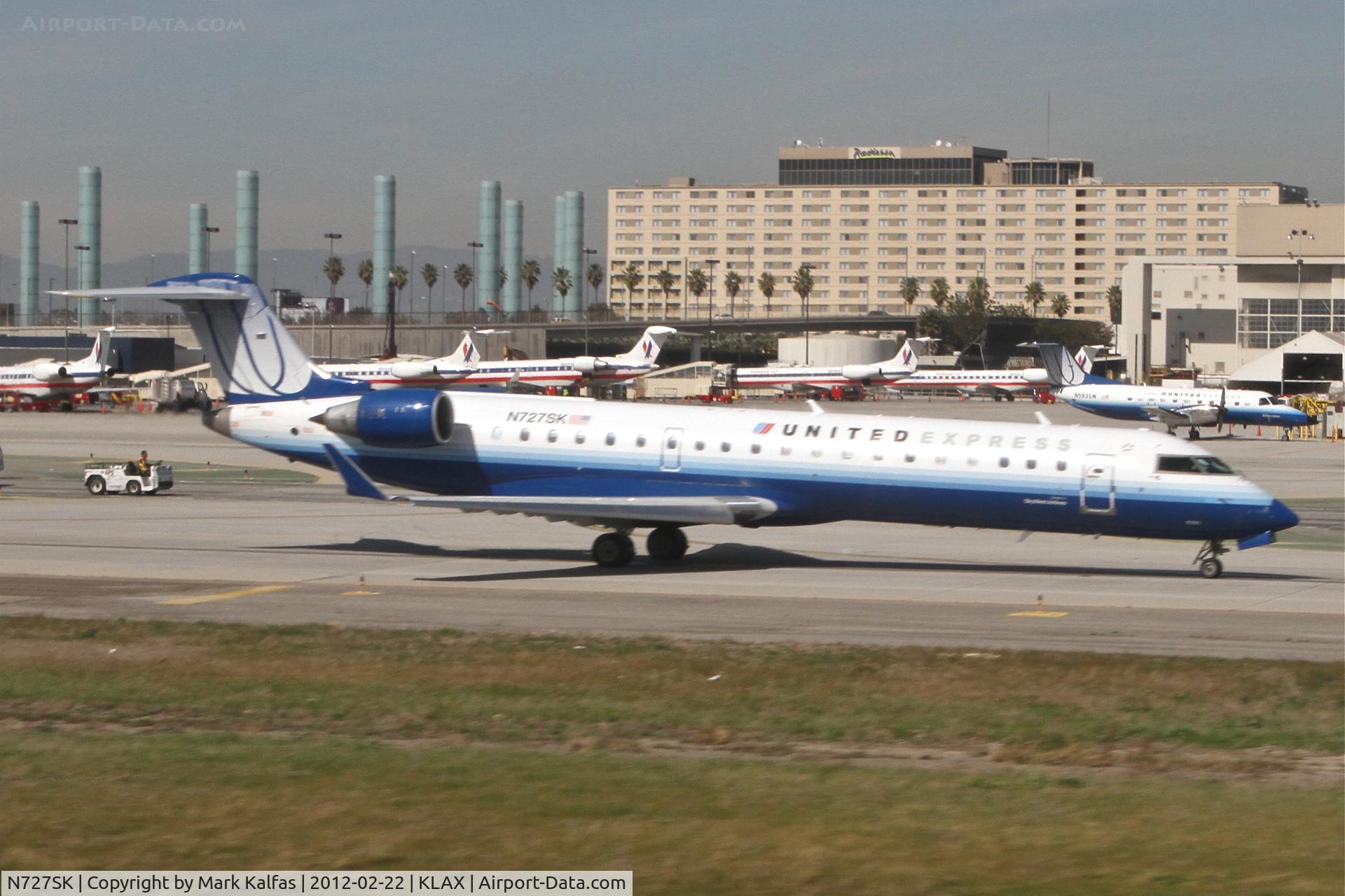 N727SK, 2005 Bombardier CRJ-701ER (CL-600-2C10) Regional Jet C/N 10191, SkyWest/United Express Bombardier CL-600-2C10, SKW6305 on TWY B in sequence for a 25R departure to KLAS.