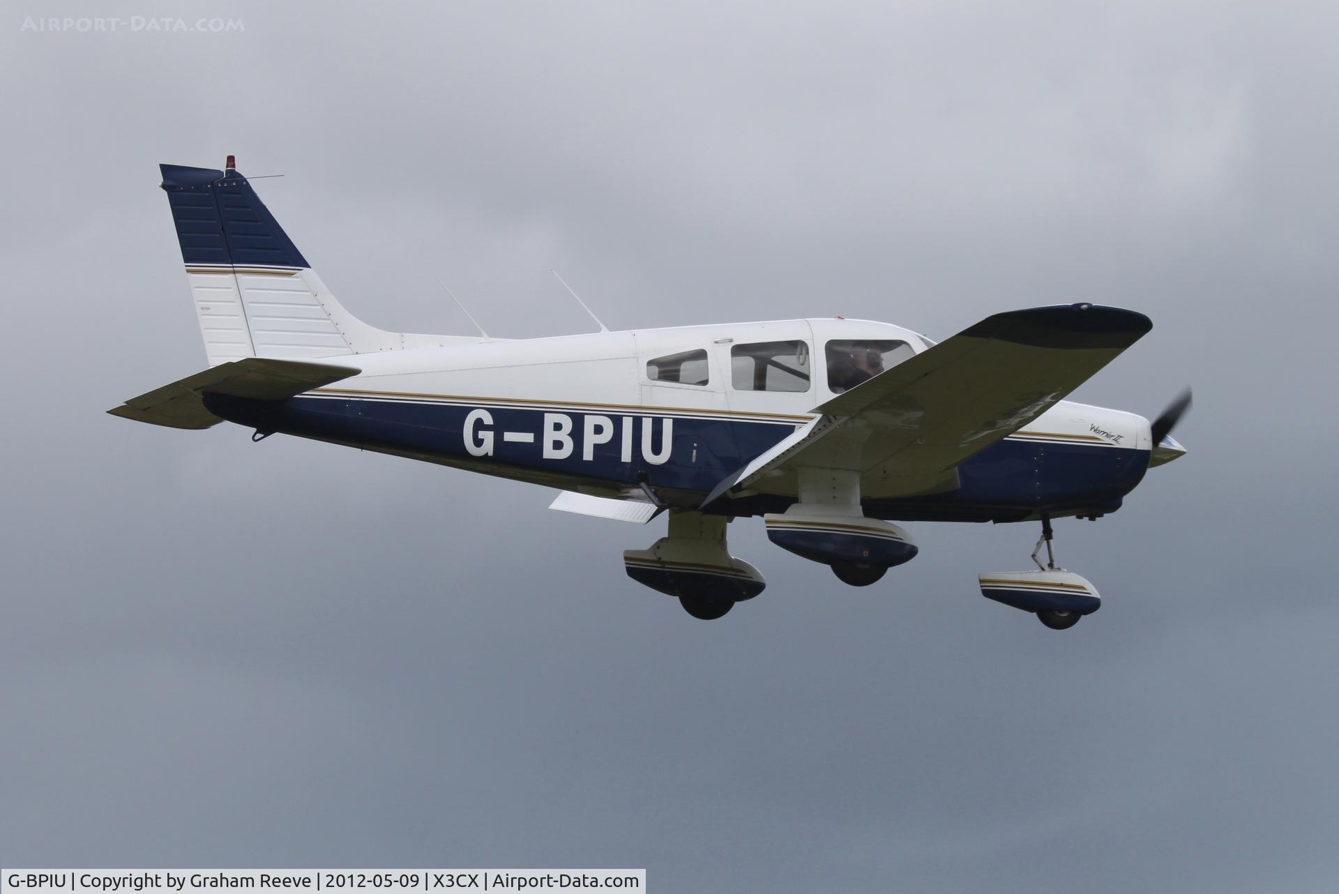 G-BPIU, 1979 Piper PA-28-161 Cherokee Warrior II C/N 28-7916303, About to touch down.