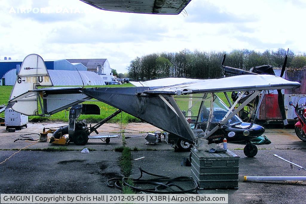 G-MGUN, 1997 Cyclone AX2000 C/N 7284, parked under the wing of the Super Guppy at Bruntingthorpe