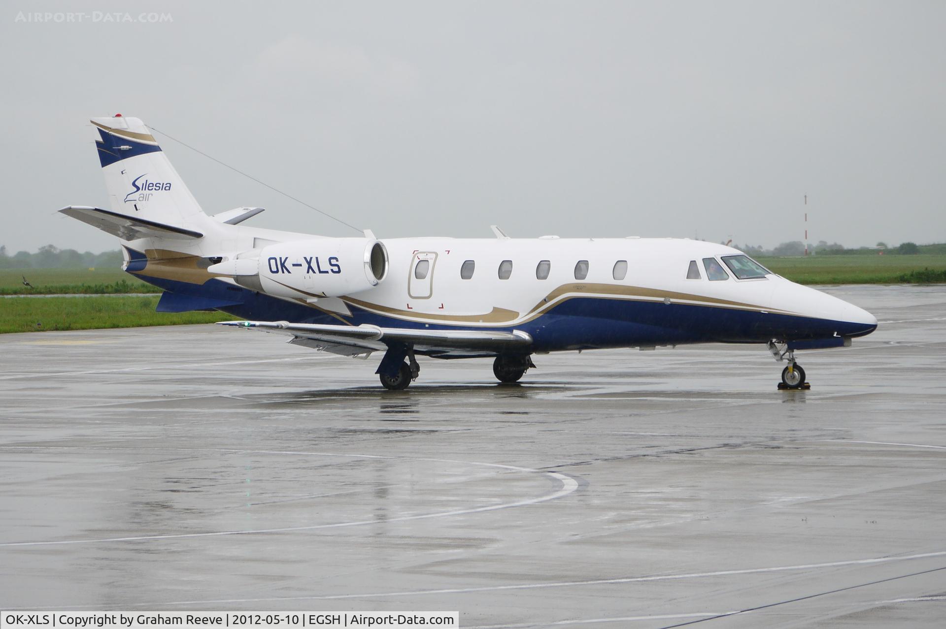 OK-XLS, 2010 Cessna 560XL Citation XLS+ C/N 560-6060, Parked at Norwich on a wet afternoon.