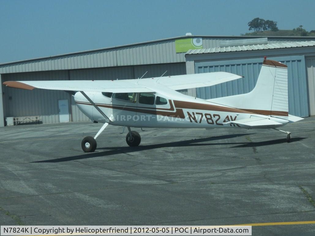N7824K, 1976 Cessna 180J C/N 18052758, Parked by a northside hanger