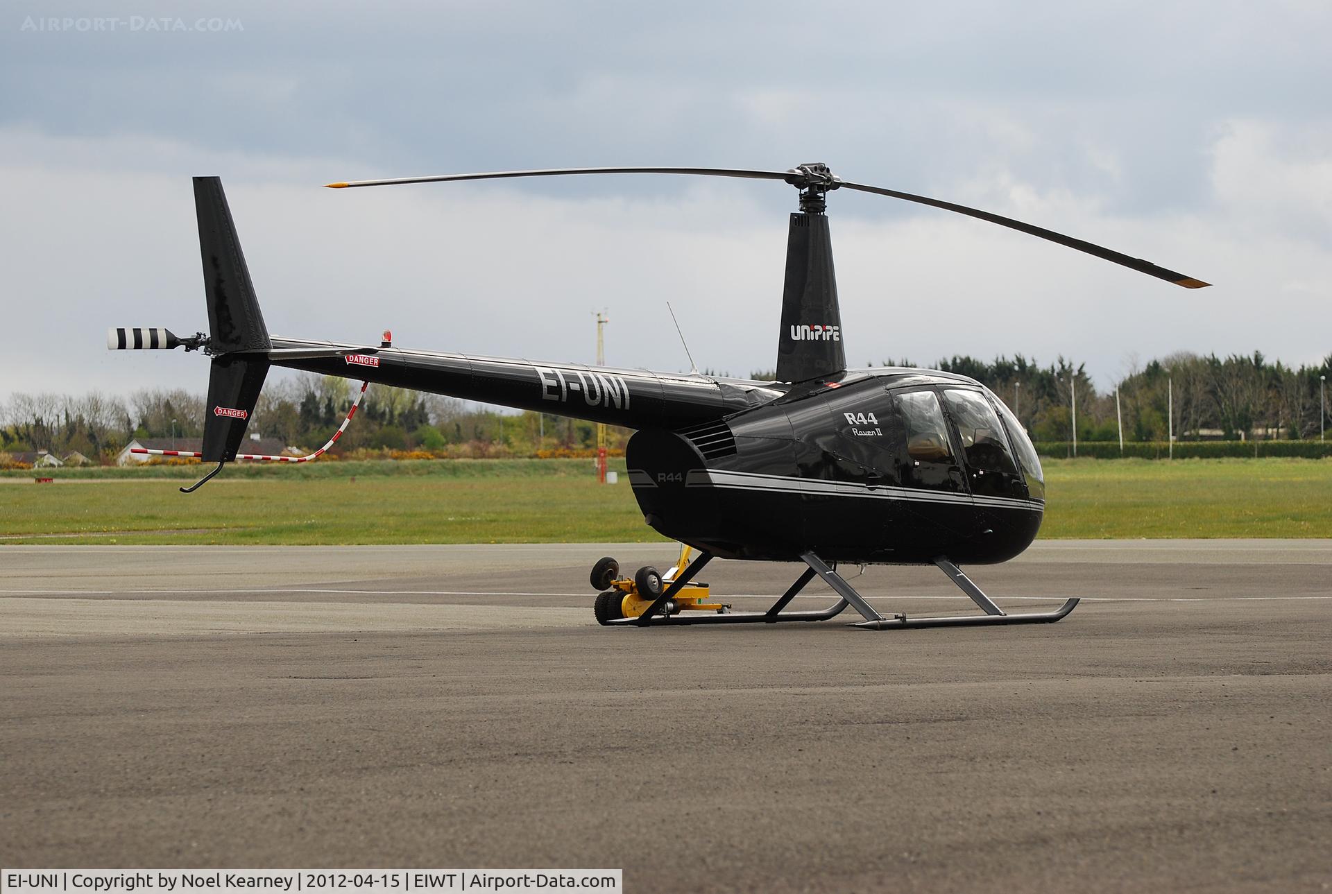 EI-UNI, 2006 Robinson R44 Raven II C/N 11498, Parked on the ramp at Weston.