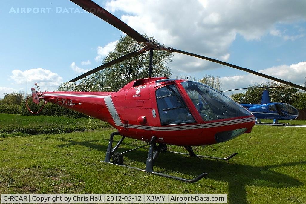 G-RCAR, 1986 Enstrom 280FX Shark C/N 2012, at the Staffordshire Heliport. Wychnor