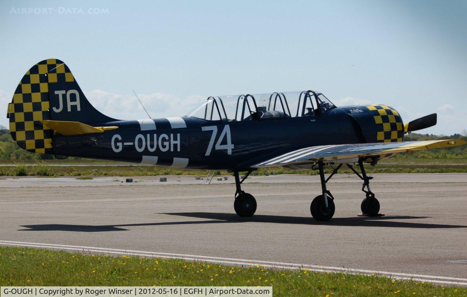 G-OUGH, 1987 Bacau Yak-52 C/N 877404, Visiting Yak-52. Marked 62/IV on port side.