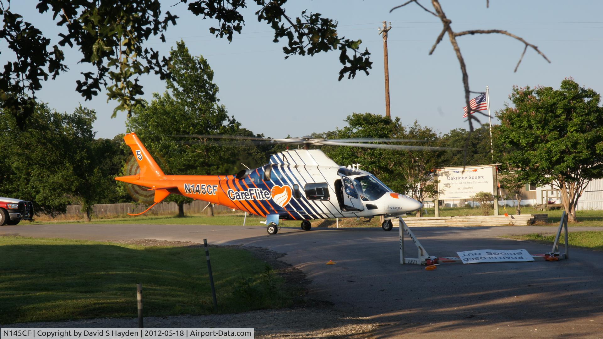 N145CF, Agusta A-109E C/N 11149, Landed 100 feet from driveway for an emengency and near by mobile home park.