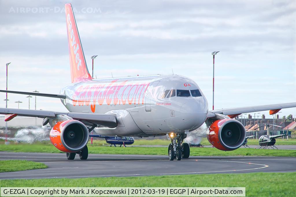 G-EZGA, 2010 Airbus A319-111 C/N 4427, 'Pride of Lisbon' on taxiway A1 en-route to runway 27.