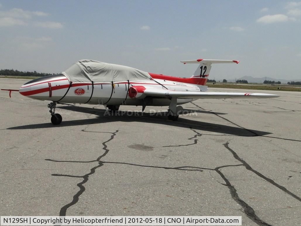 N129SH, 1966 Aero L-29 Delfin C/N 691930, Parked south of the Tower and canopy, engine inlets covered from the elements