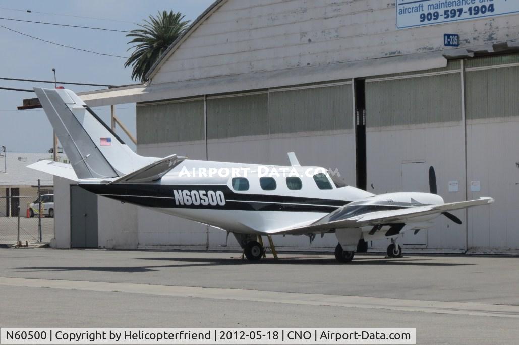 N60500, 1979 Beech B-60 Duke C/N P-500, Parked by a maintenance hanger