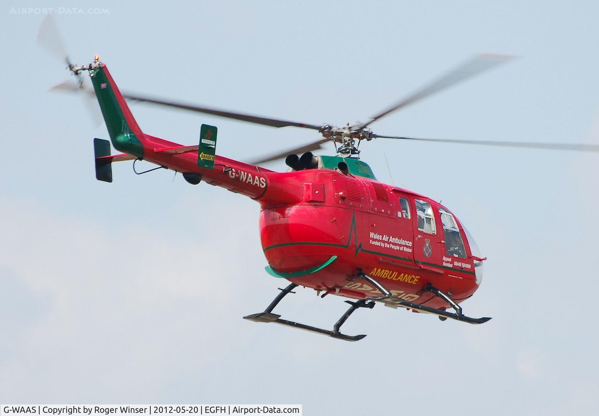 G-WAAS, 1992 MBB Bo.105DBS-4 C/N S.138/911, Mid-Wales Air Ambulance helicopter (Helimed 59) departing for it's Welshpool Airport base .