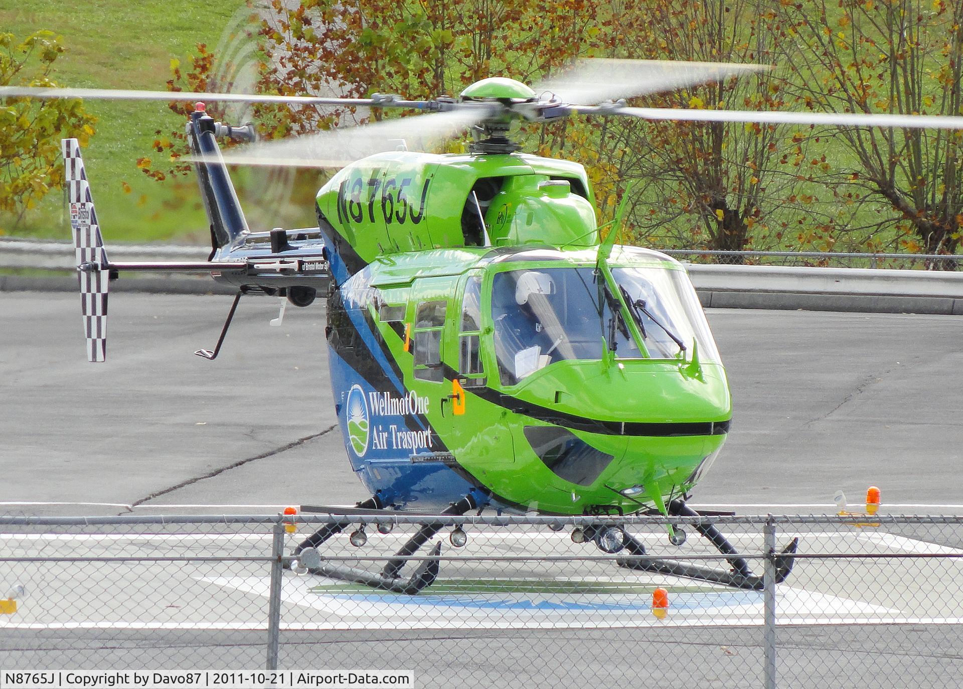 N8765J, 1984 Eurocopter-Kawasaki BK-117A-4 C/N 7054, WellmontOne Air Transport warms up prior to liftoff from the Bristol Motor Speedway helipad.