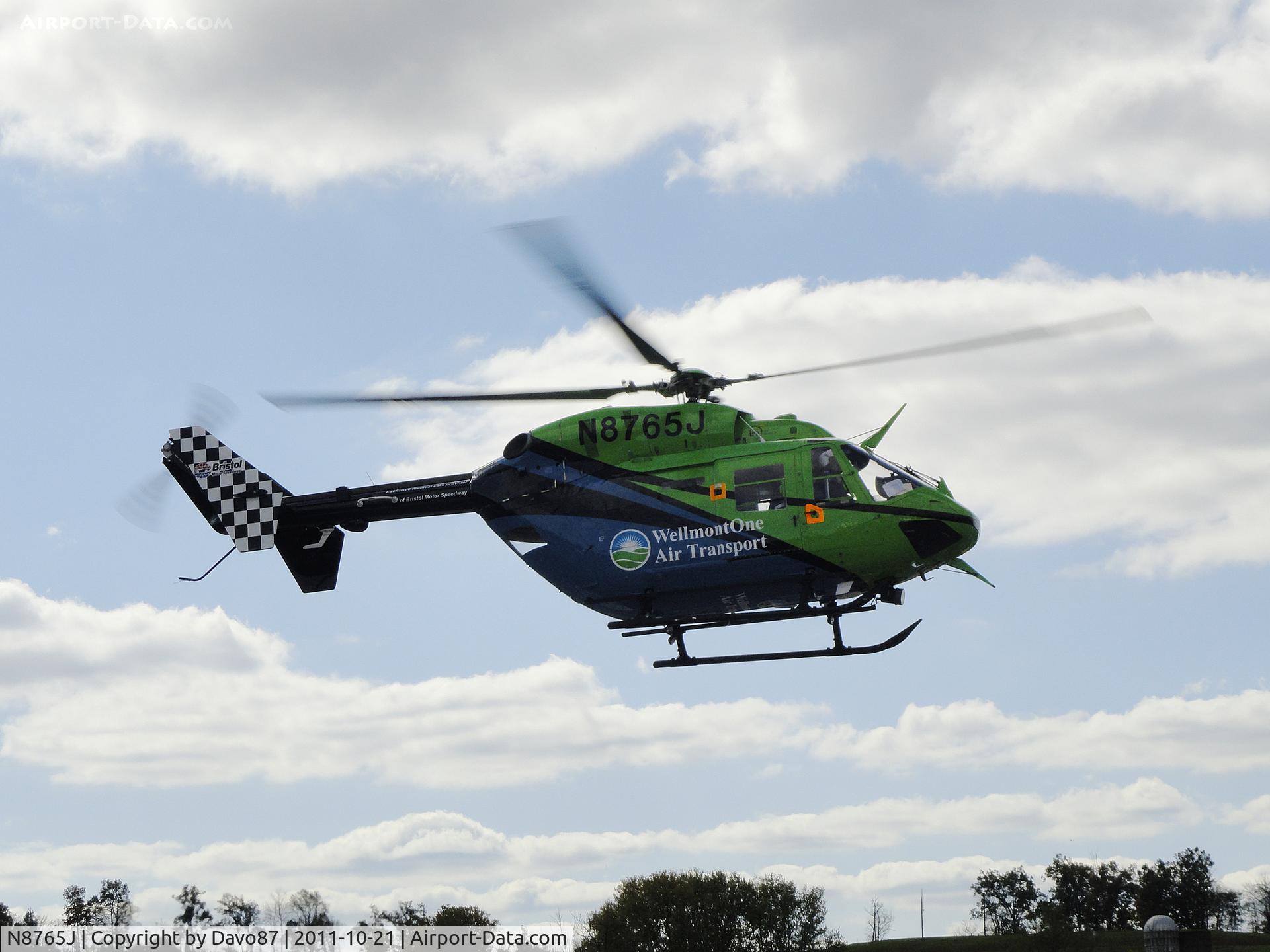 N8765J, 1984 Eurocopter-Kawasaki BK-117A-4 C/N 7054, WellmontOne Air Transport lifts off from Bristol Motor Speedway helipad.