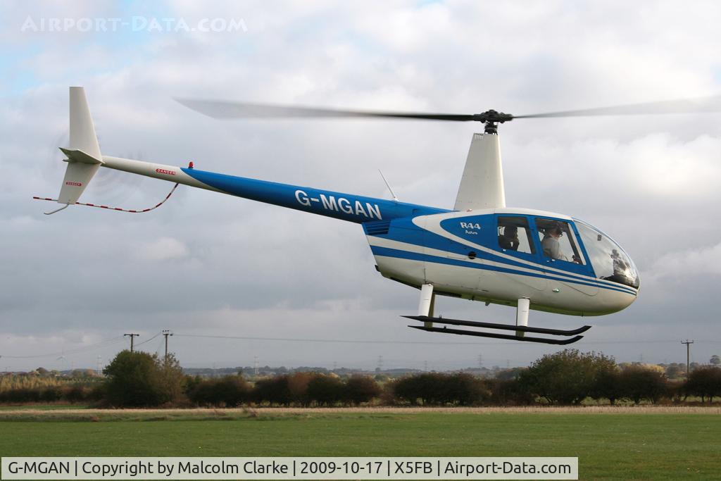 G-MGAN, 1999 Robinson R44 C/N 0588, Robinson R44, Fishburn Airfield, October 2009.