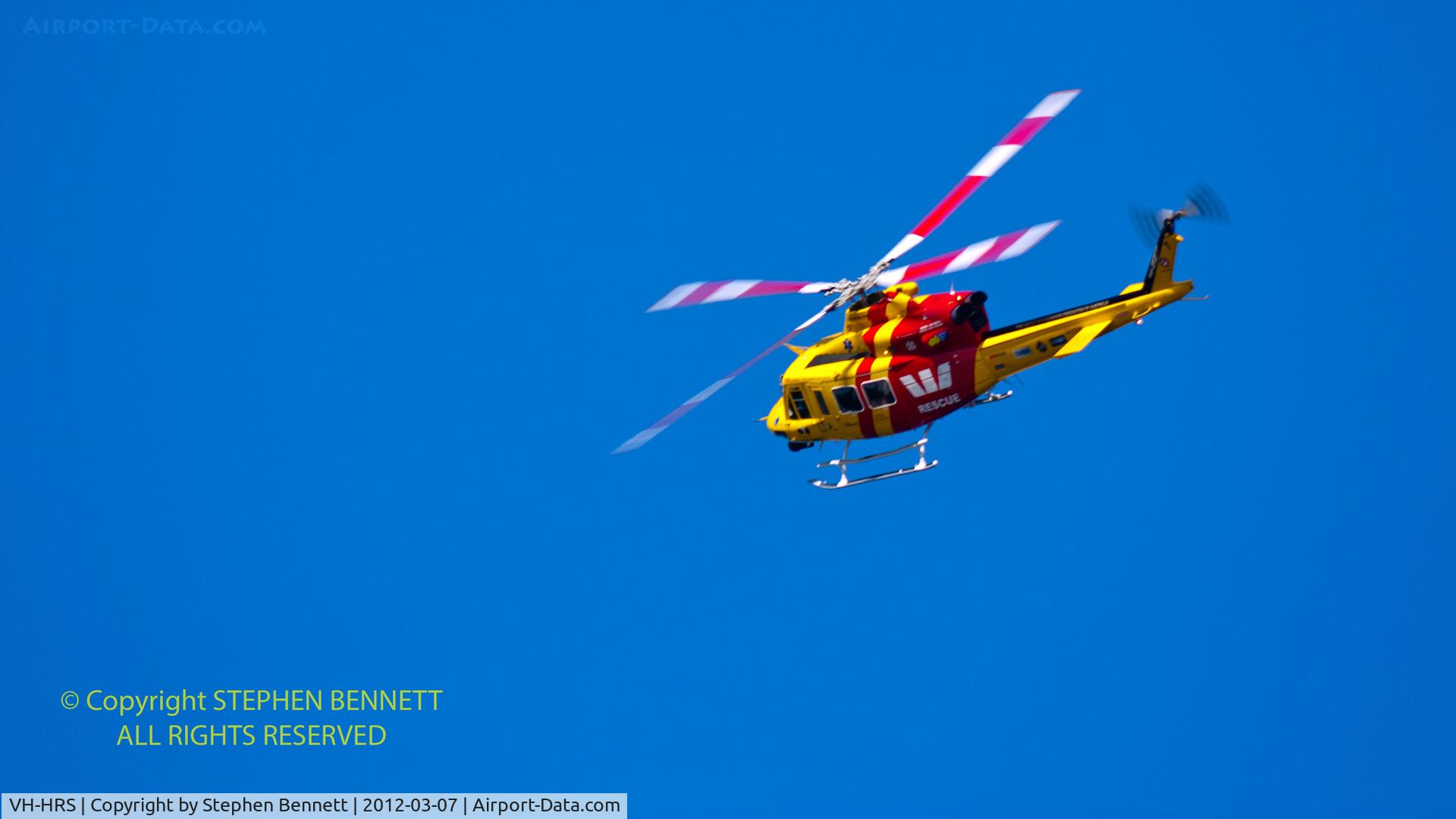 VH-HRS, Bell 412 C/N 33118, Westpac 1 Rescue Helicopter banks into a clear blue sky above its headquarters in Broadmeadow, NSW, Australia