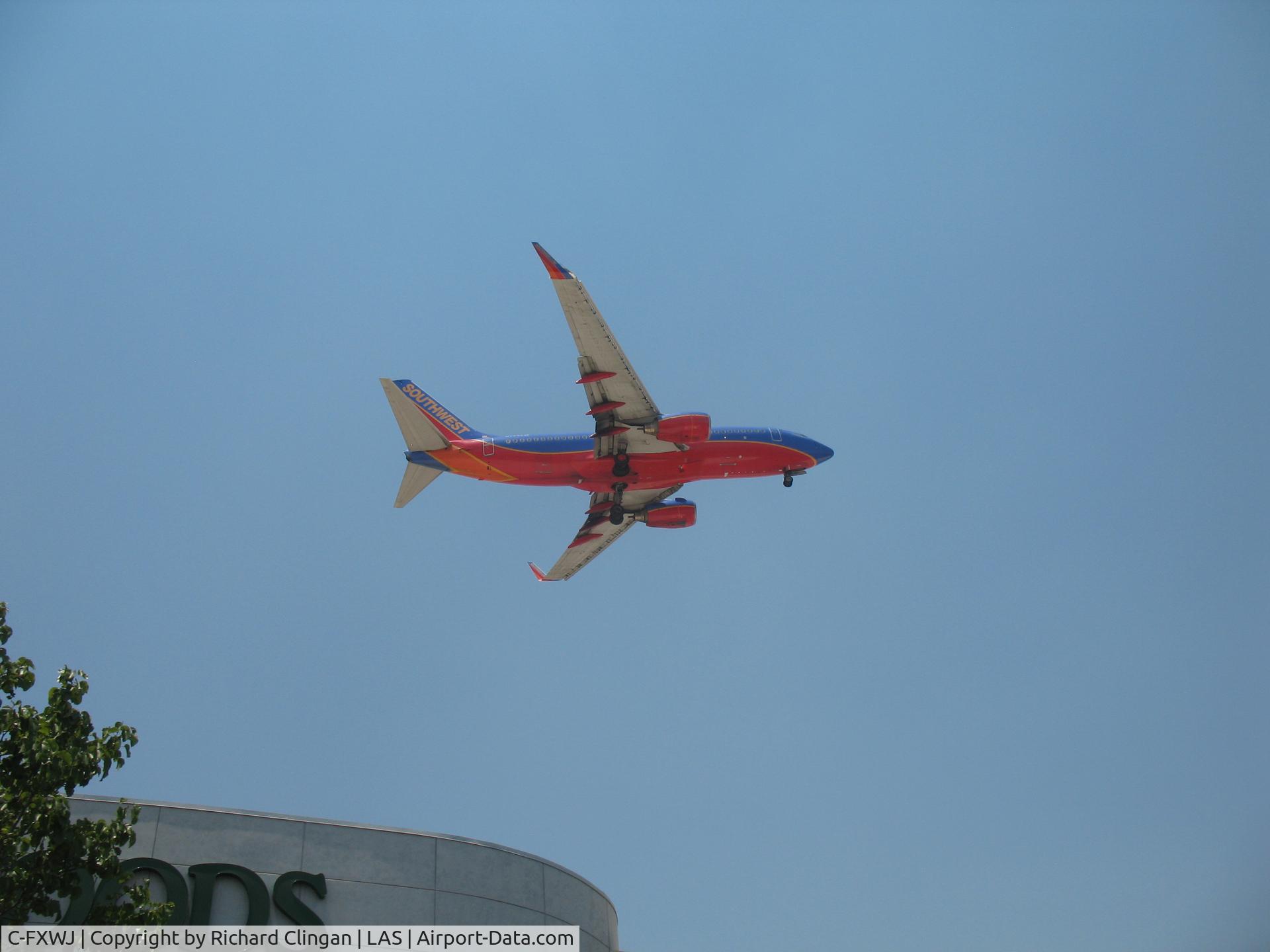 C-FXWJ, 2005 Boeing 737-7CT C/N 32768, Landing at Mc Carran airport, Las Vegas on 5-23-12
Picture taken in Target parking lot by airport.
