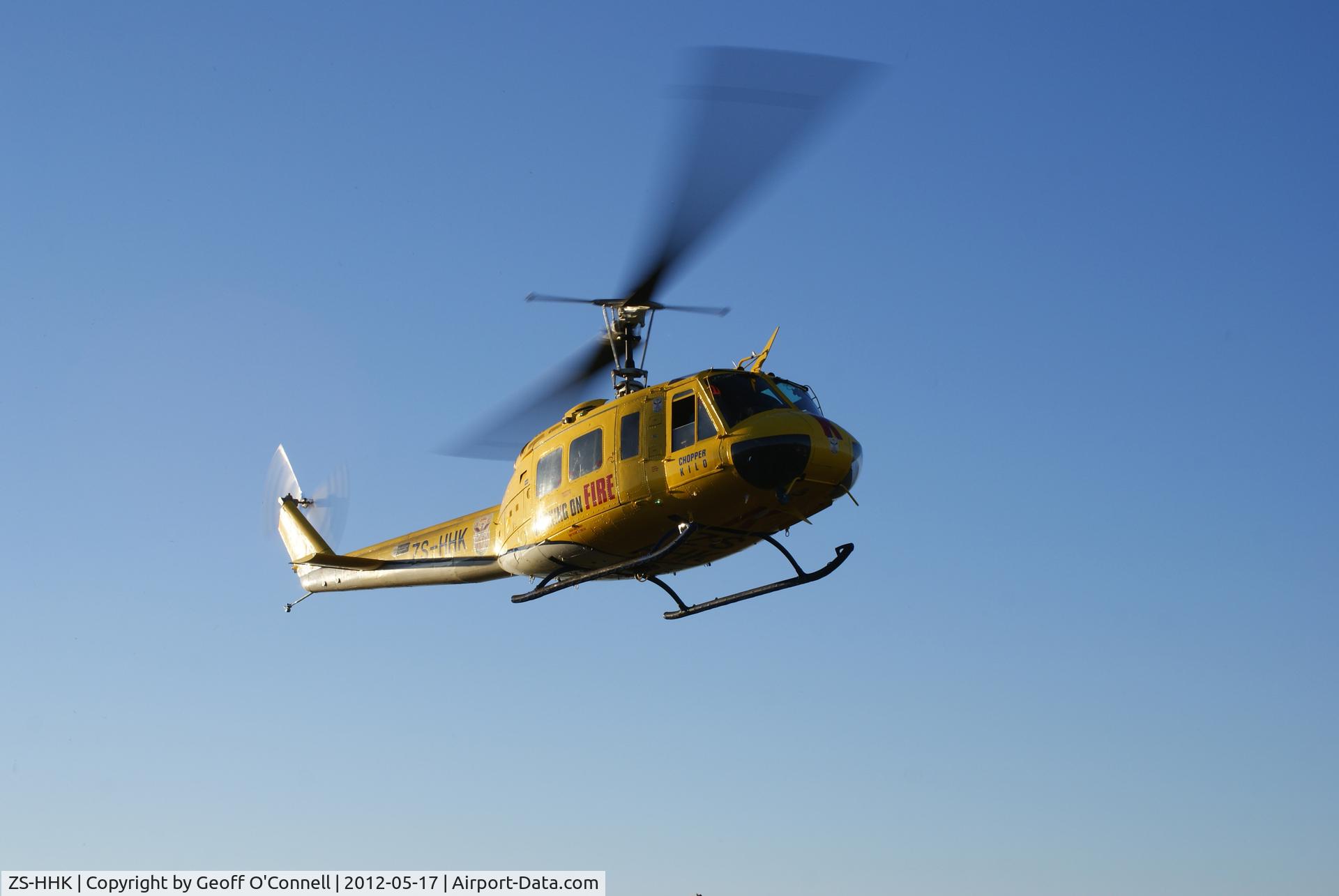 ZS-HHK, 1971 Bell UH-1H C/N 12839, Huey arriving early morning on the soccer field of the Pietermaritzburg Correctional Centre. The work for the day was the lifting of 4×1300kg ventilation units