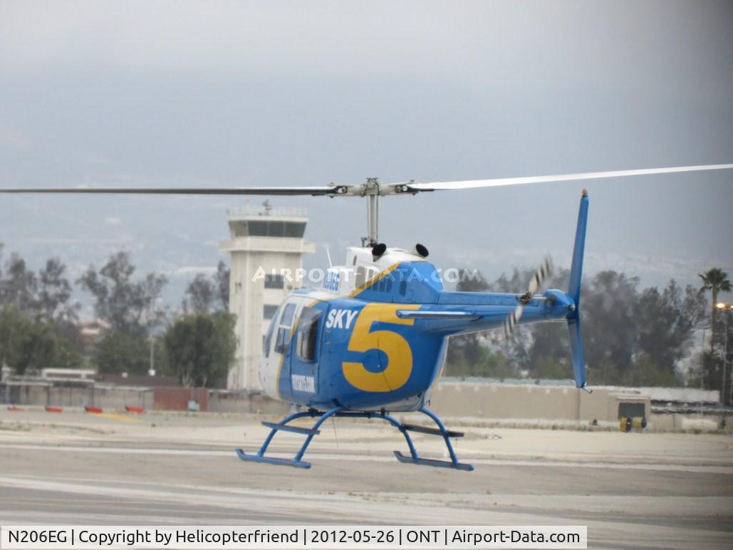 N206EG, 1975 Bell 206B JetRanger II C/N 1570, Air taxiing towards runway 26L
