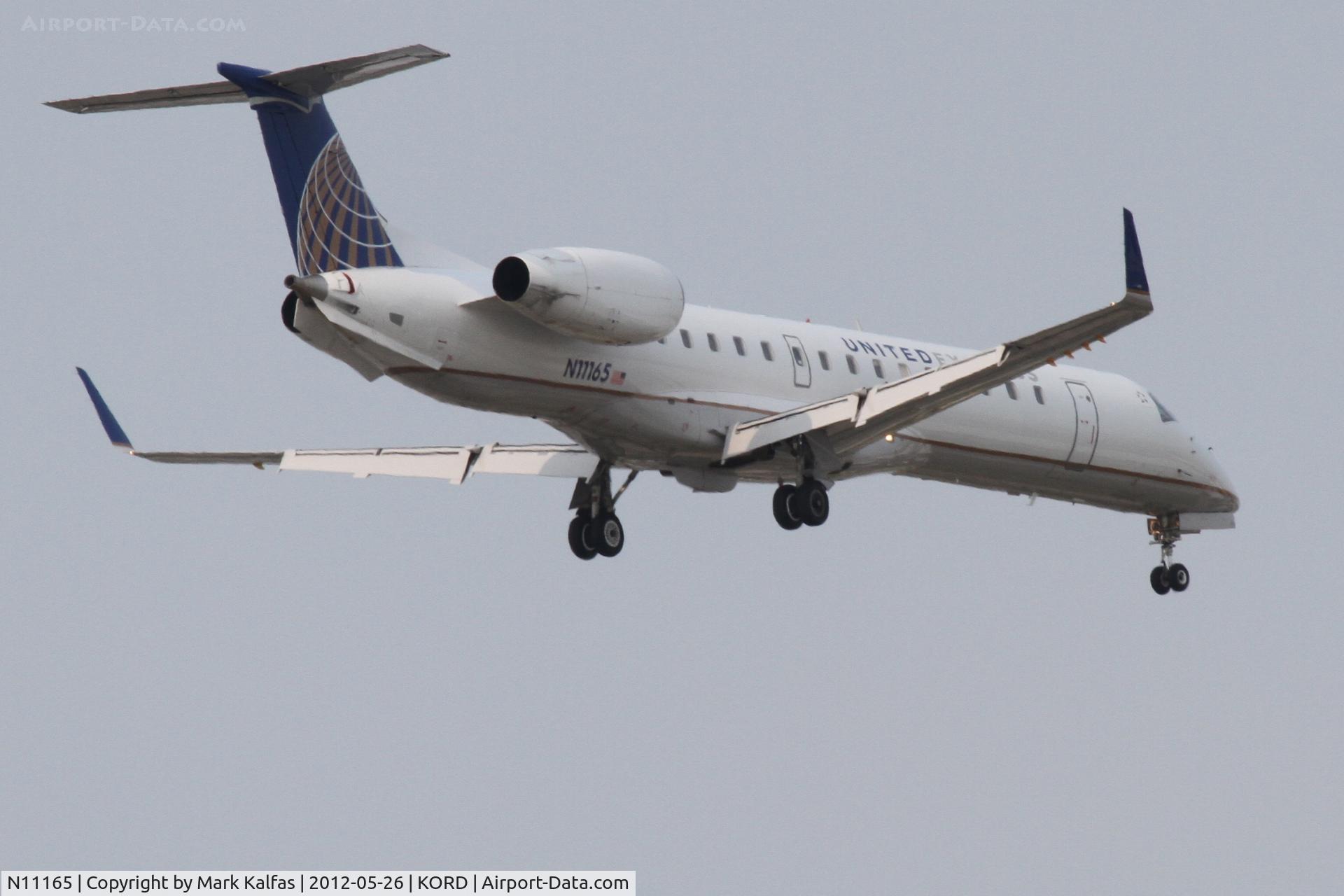 N11165, 2004 Embraer ERJ-145XR (EMB-145XR) C/N 14500819, ExpressJet Embraer EMB-145XR, ASQ5949 arriving from KIND, RWY 10 approach KORD.