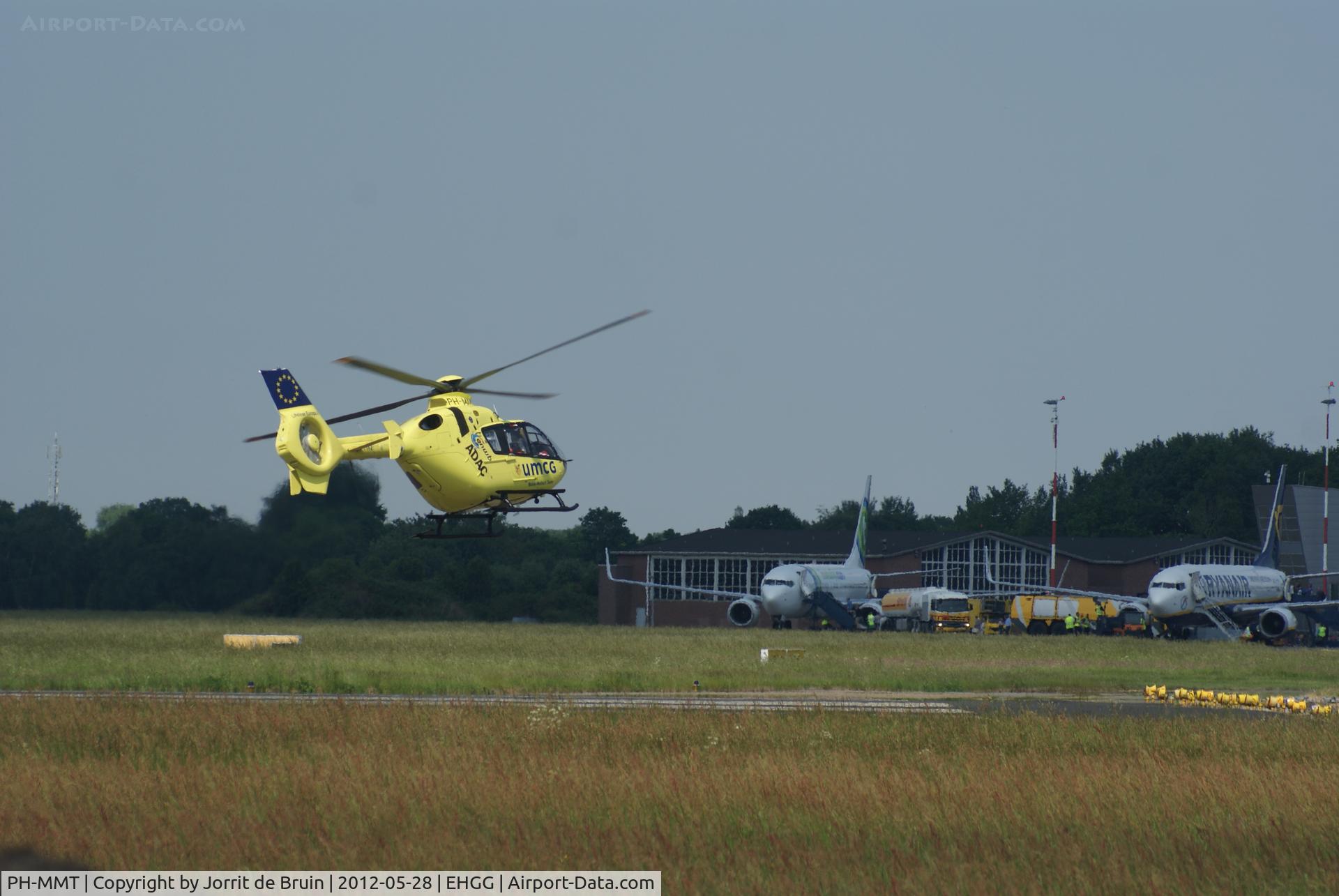 PH-MMT, 2010 Eurocopter EC-135P-2+ C/N 0871, Another picture of the Lifeliner 4 vacating the runway for the daily refuel. You might also see two passenger planes.