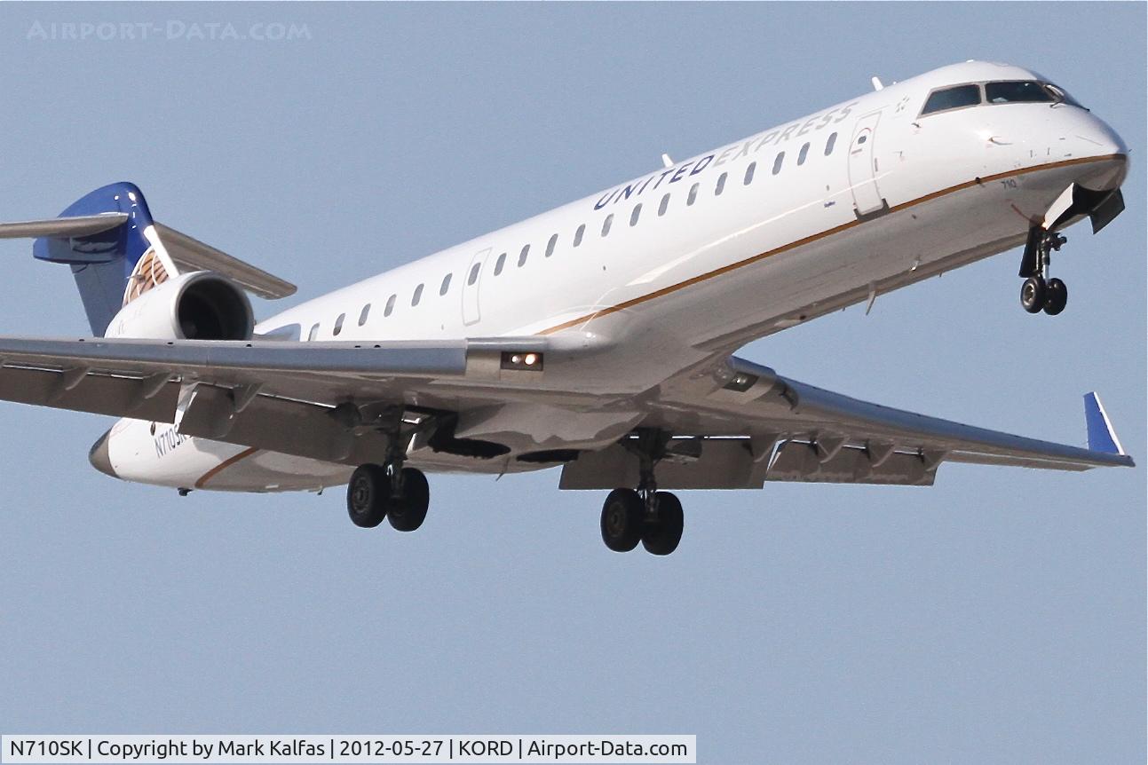 N710SK, 2004 Bombardier CRJ-700 (CL-600-2C10) Regional Jet C/N 10170, SkyWest/United Express Bombardier CL-600-2C10, SKW6267 arriving from Colorado Sprgs Municipal Airport /KCOS, RWY 14R approach at O'hare.