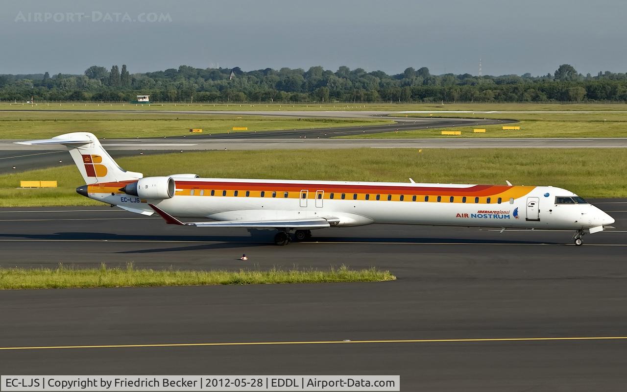 EC-LJS, 2010 Bombardier CRJ-1000ER NG (CL-600-2E25) C/N 19003, being towed to the gate