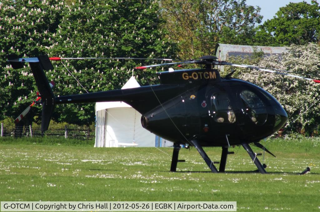 G-OTCM, MD Helicopters 369E C/N 0574E, at AeroExpo 2012