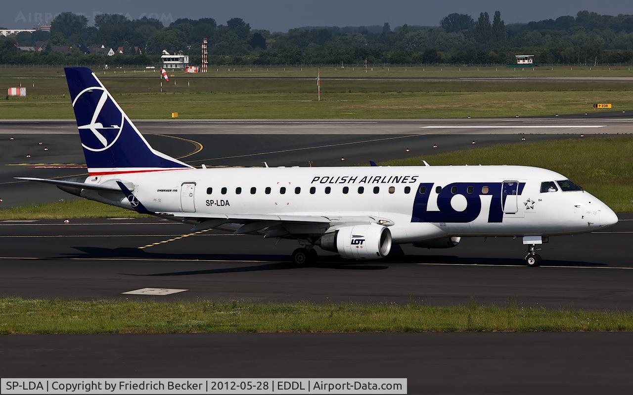 SP-LDA, 2004 Embraer 170ST (ERJ-170-100ST) C/N 17000023, taxying to the active