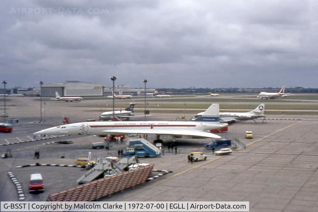 G-BSST, 1966 Aerospatiale-BAC Concorde Prototype C/N 002/13520, Concorde prototype 002 at London Heathrow on its return from a Far East sales tour. In front of the forward door are the flags of the nations visited. Also seen are two 707's, two Tridents, a 747, a Caravelle and a 727.