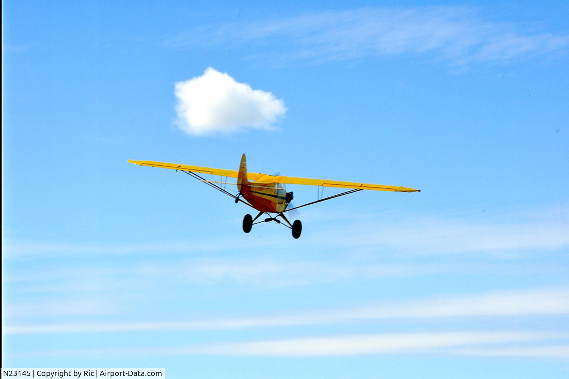 N23145, 1939 Piper J3C-65 Cub C/N 2924, aircraft in stuble field. Airstreak 21