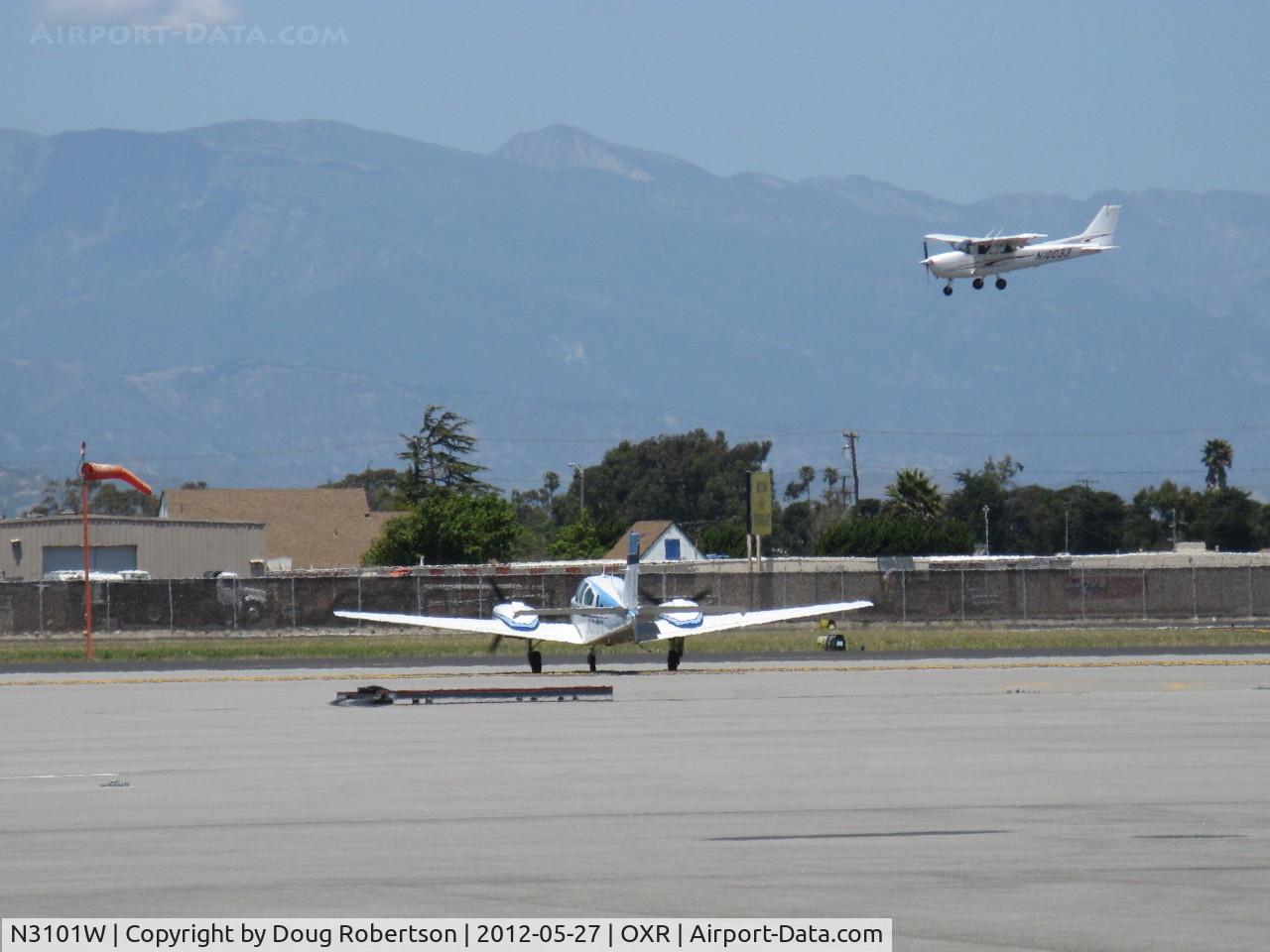 N3101W, 1973 Beech E-55 Baron C/N TE-953, 1973 Beech E55 BARON, two Continental IO-520-C 285 Hp each, holding short Rwy 25. N10033 2005 Cessna 172S SKYHAWK SP on final Rwy 25, a twofer