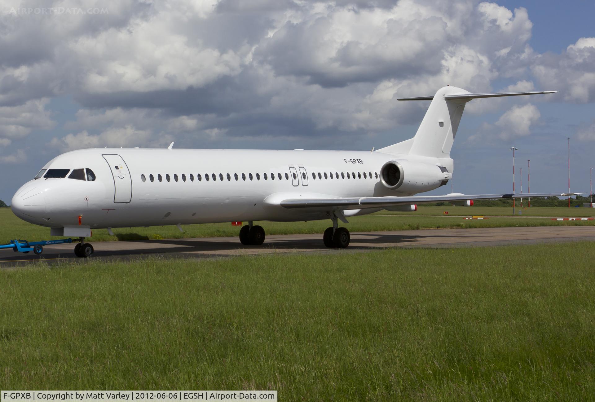 F-GPXB, 1994 Fokker 100 (F-28-0100) C/N 11492, Being towed to the compass swing area.