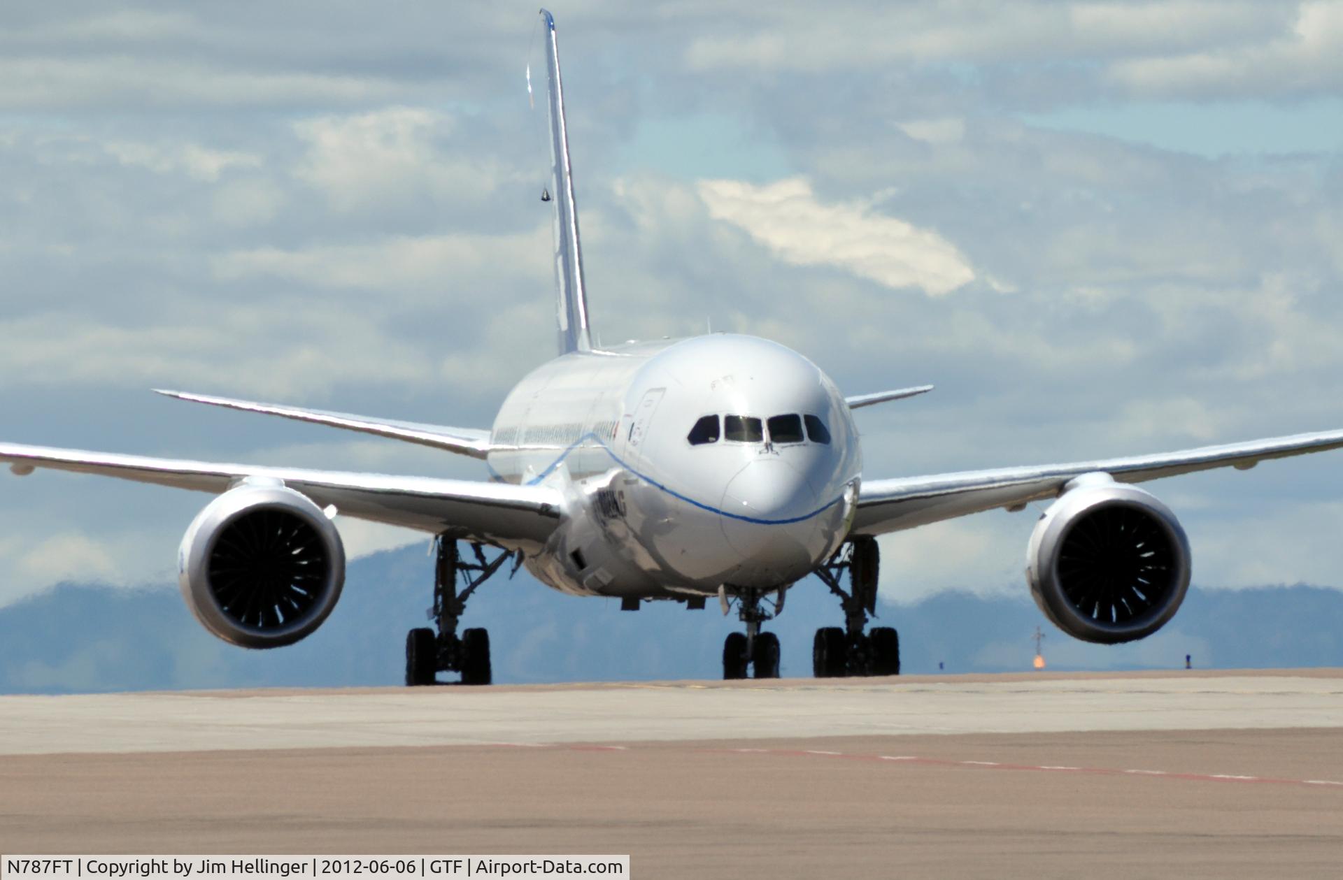 N787FT, 2010 Boeing 787-8 Dreamliner C/N 40694, Boeing 787-8 taxiing at GTF on a VERY Windy day! (note sensor hanging from the top of the tail)