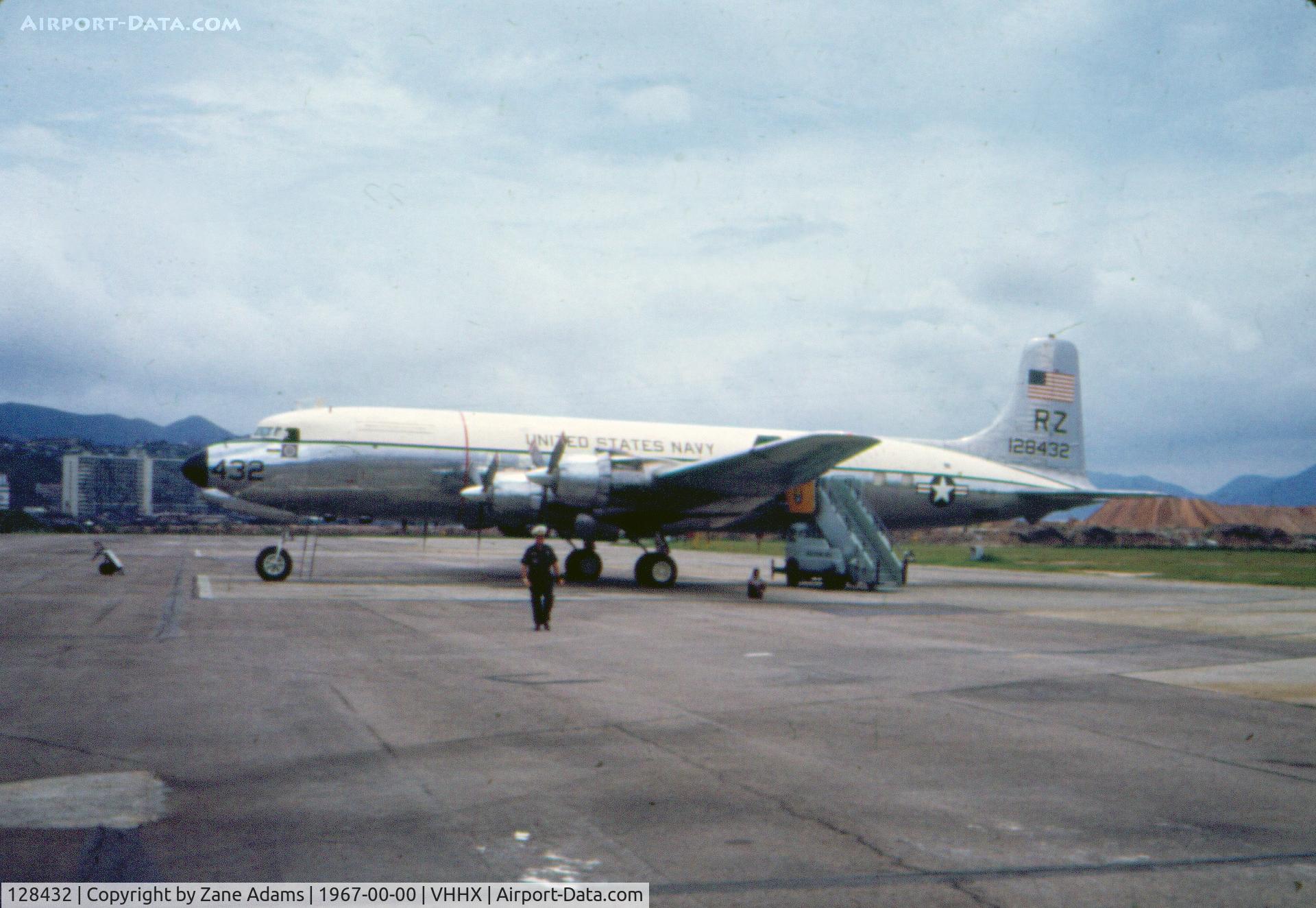 128432, 1952 Douglas VC-118B Liftmaster (R6D-1) C/N 43405, Photographed in Hong Kong - scanned from a 35mm slide bought at an estate sale.This aircraft was USAF as 50-1844.  Returned to USN, converted to VC-118B To MASDC as 8C0007 Aug 8, 1976.  Last seen in scrapyard near AMARC early 2001