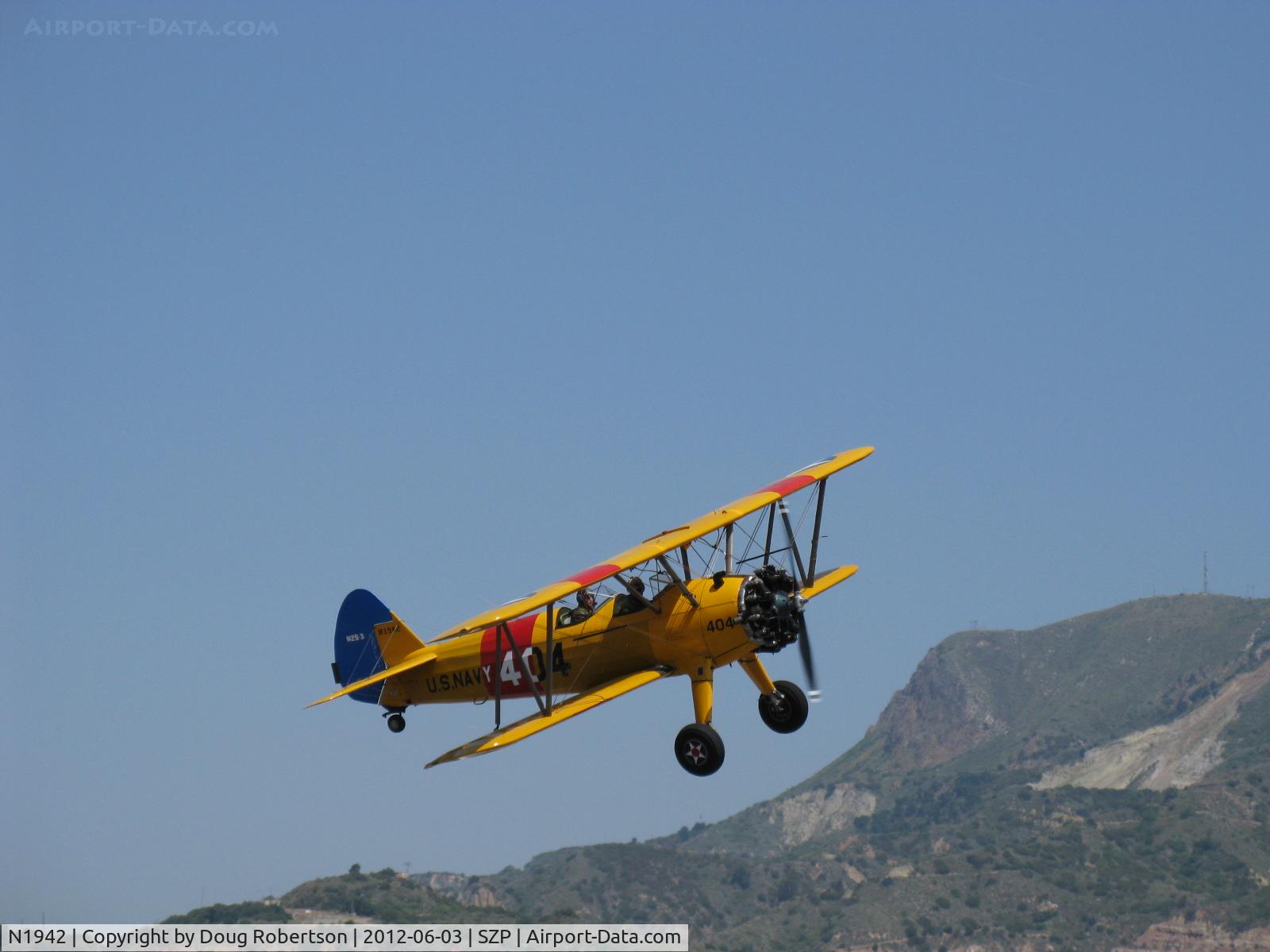 N1942, 1942 Boeing A75N1(PT17) C/N 75-6754, 1942 Boeing Stearman A75N1 as Navy N2S-3, Continental W670 220 Hp, takeoff climb Rwy 22 with a wing waggle